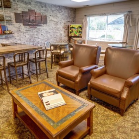 Find your perfect fit at The Auberge at Aspen Park a room with chairs and tables